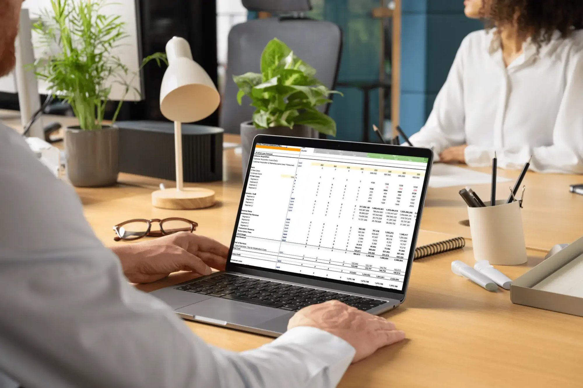A business professional reviewing a dynamic financial model on a laptop, representing the data-driven approach used to map 10-year market evolution across industrial segments. A business professional reviewing a dynamic financial model on a laptop, representing the data-driven approach used to map 10-year market evolution across industrial segments.